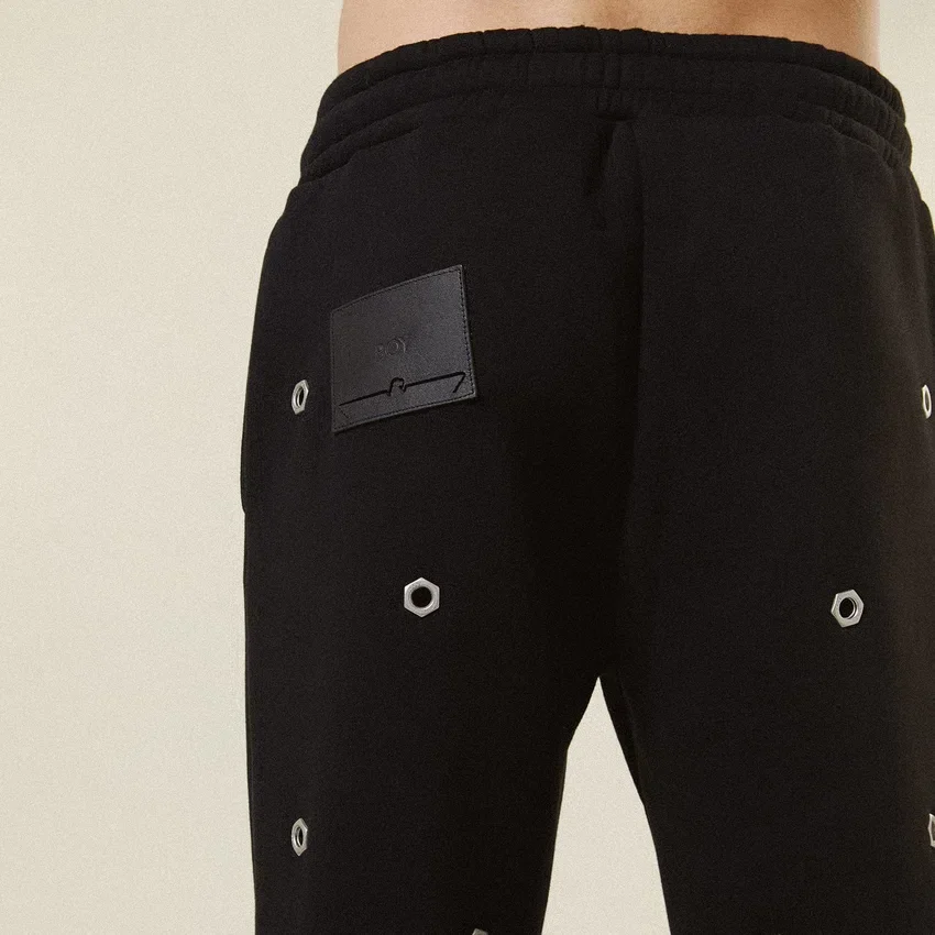Pantalon de survêtement à œillets multiples
